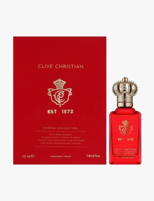 Clive Christian Crown Collection Crab Apple Blossom 50ml bottle in soft coral tones with gold crown cap, styled in a fresh, spring-inspired setting.